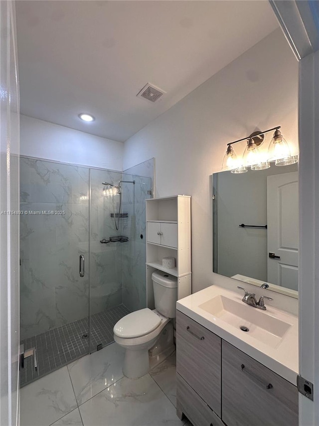 full bath with a marble finish shower, visible vents, toilet, marble finish floor, and vanity