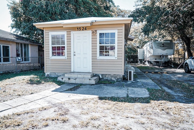 view of outbuilding with an outbuilding and fence