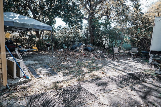 view of yard featuring fence and a gazebo