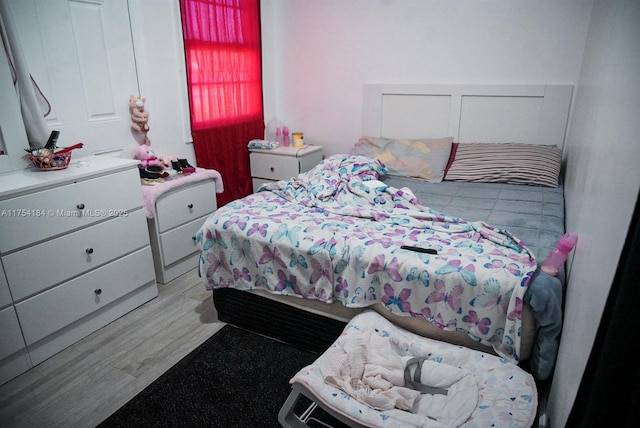 bedroom featuring wood finished floors