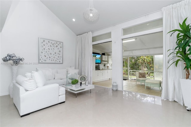 living area with high vaulted ceiling and recessed lighting