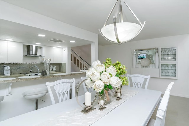 dining room with recessed lighting, visible vents, and stairway