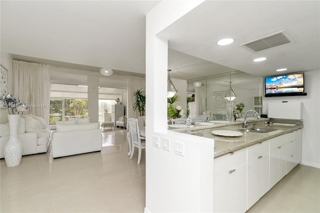 bathroom featuring recessed lighting, visible vents, and vanity