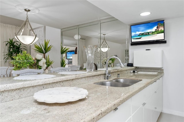 interior space with a sink and recessed lighting