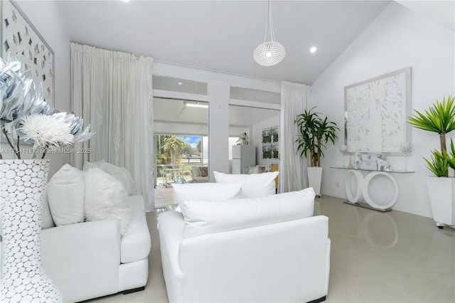 living room with recessed lighting and vaulted ceiling