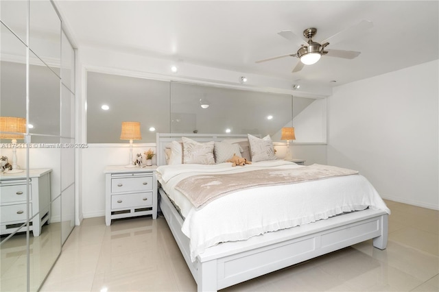 bedroom with light tile patterned flooring and a ceiling fan