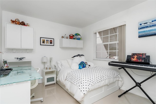 bedroom featuring light tile patterned flooring