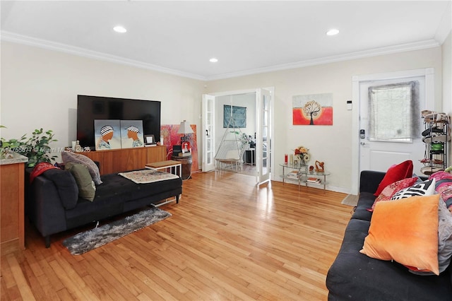 living room with recessed lighting, crown molding, and light wood-type flooring