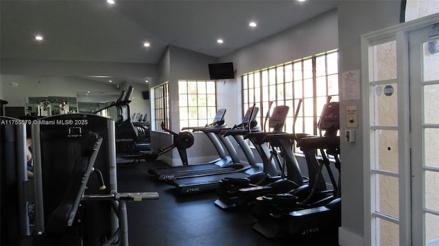 exercise room with vaulted ceiling and recessed lighting