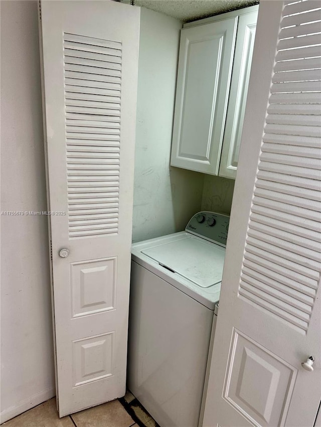 laundry room with cabinet space and washer / clothes dryer