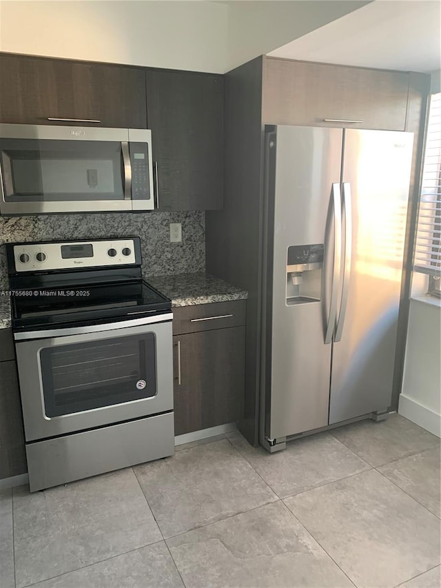 425 W Park Dr Unit 12, Miami, FL 33172 - kitchen featuring appliances with stainless steel finishes, stone counters, and backsplash