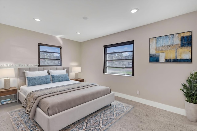 bedroom featuring baseboards and recessed lighting