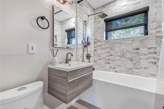 bathroom featuring shower / tub combination, vanity, and toilet