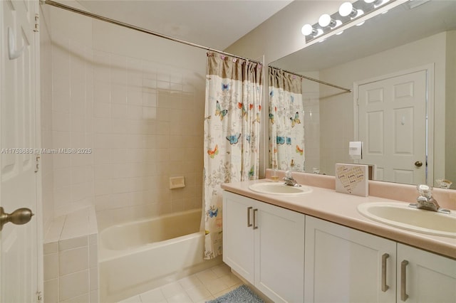 full bath with double vanity, tile patterned flooring, a sink, and shower / bath combo with shower curtain