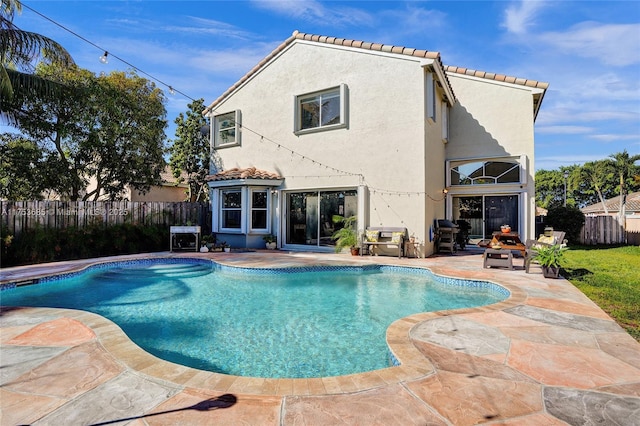 view of swimming pool featuring a fenced in pool, a patio area, and fence