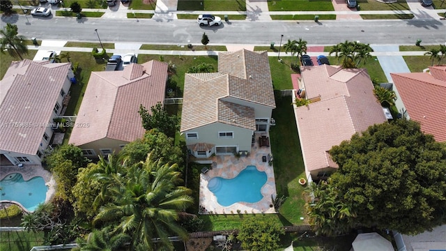 birds eye view of property with a residential view