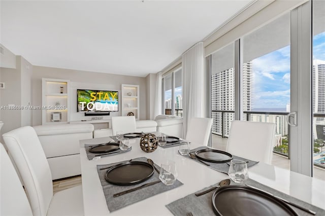 dining area featuring floor to ceiling windows