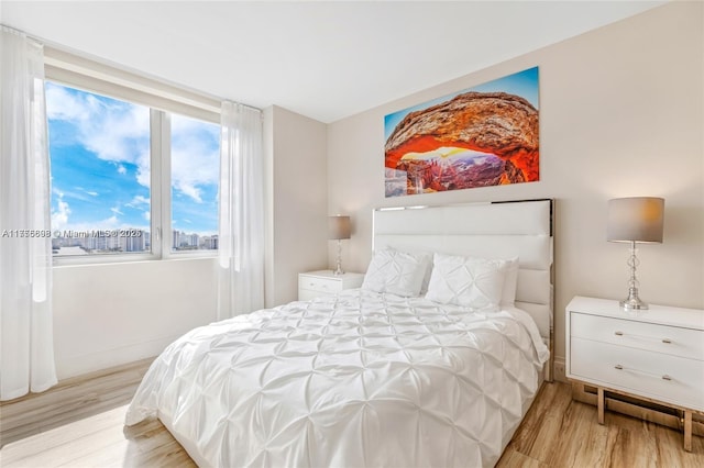 bedroom with wood finished floors