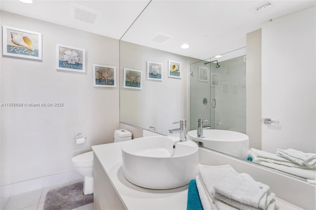 full bath featuring toilet, a stall shower, visible vents, and tile patterned floors