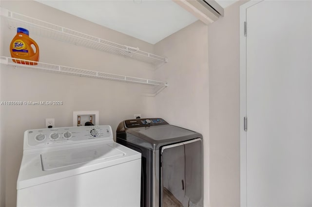 washroom with laundry area and washer and clothes dryer