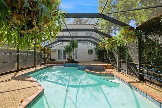 view of swimming pool featuring a fenced in pool, french doors, a patio area, fence, and a lanai