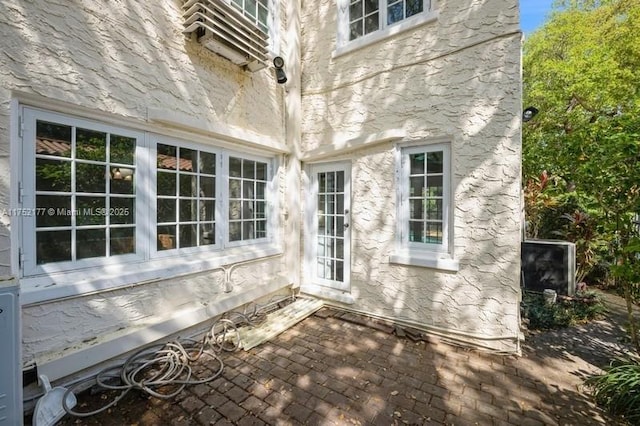 doorway to property with a patio area