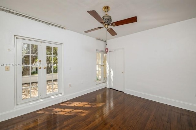 empty room with a ceiling fan, french doors, baseboards, and hardwood / wood-style floors