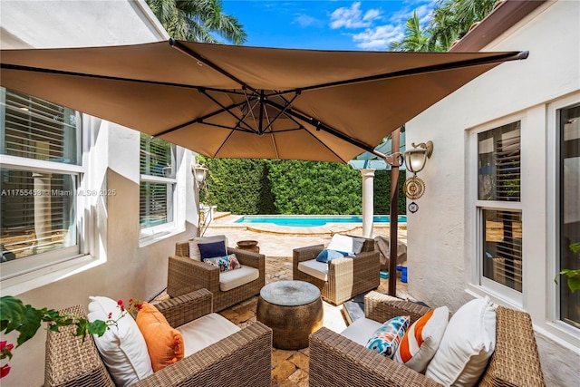 view of patio with outdoor lounge area and an outdoor pool