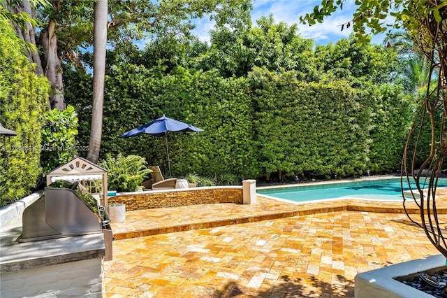 outdoor pool with a patio area and a gazebo