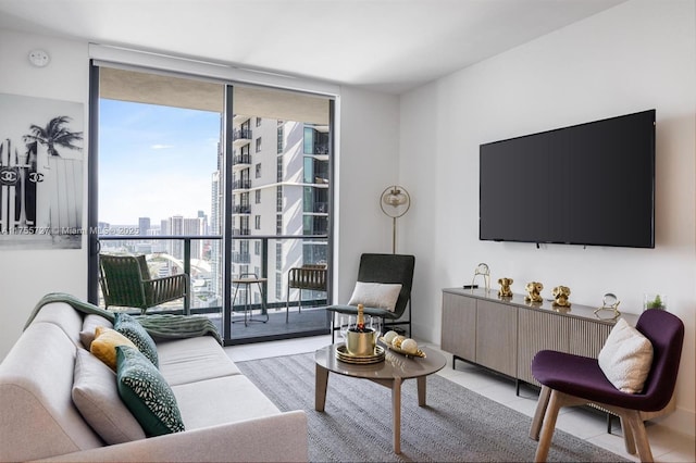 living area with light tile patterned floors and a wall of windows