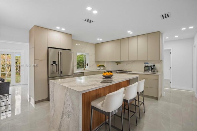 5280 SW 90th Ave, Cooper City, FL 33328 - kitchen with appliances with stainless steel finishes, modern cabinets, cream cabinets, backsplash, and recessed lighting