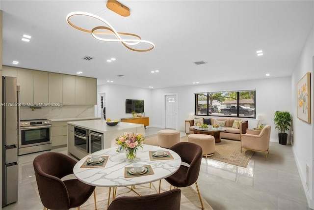 5280 SW 90th Ave, Cooper City, FL 33328 - dining area featuring wine cooler, recessed lighting, and baseboards