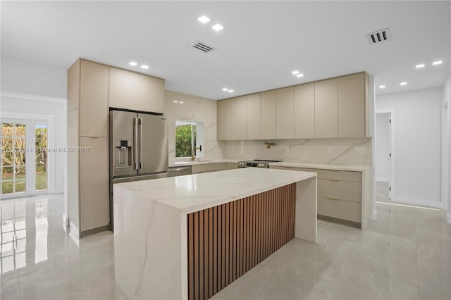 5280 SW 90th Ave, Cooper City, FL 33328 - kitchen with appliances with stainless steel finishes, modern cabinets, cream cabinets, tasteful backsplash, and recessed lighting