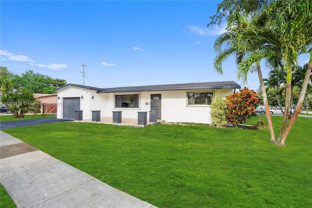 5280 SW 90th Ave, Cooper City, FL 33328 - view of front facade with driveway, stucco siding, an attached garage, a front lawn, and central air condition unit