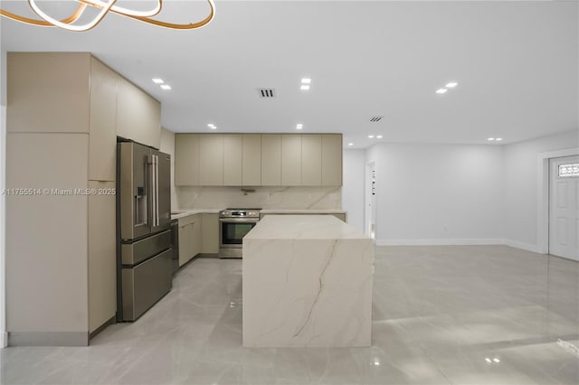 5280 SW 90th Ave, Cooper City, FL 33328 - kitchen with stainless steel appliances, modern cabinets, light stone countertops, recessed lighting, and cream cabinetry