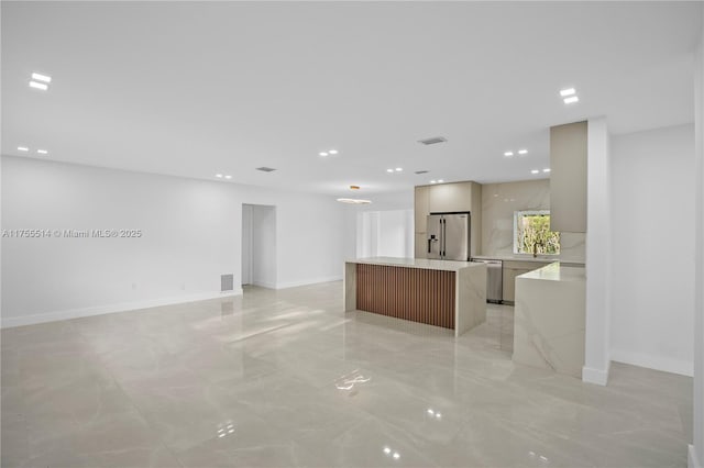 5280 SW 90th Ave, Cooper City, FL 33328 - kitchen featuring modern cabinets, stainless steel appliances, light marble finish flooring, light countertops, and a center island