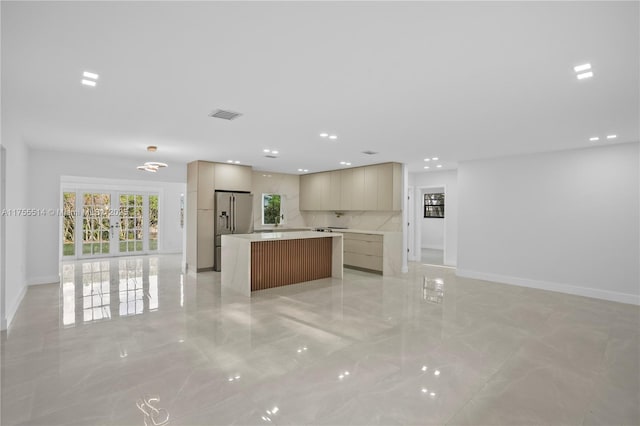 5280 SW 90th Ave, Cooper City, FL 33328 - kitchen with modern cabinets, light marble finish floors, high end refrigerator, a kitchen island, and recessed lighting