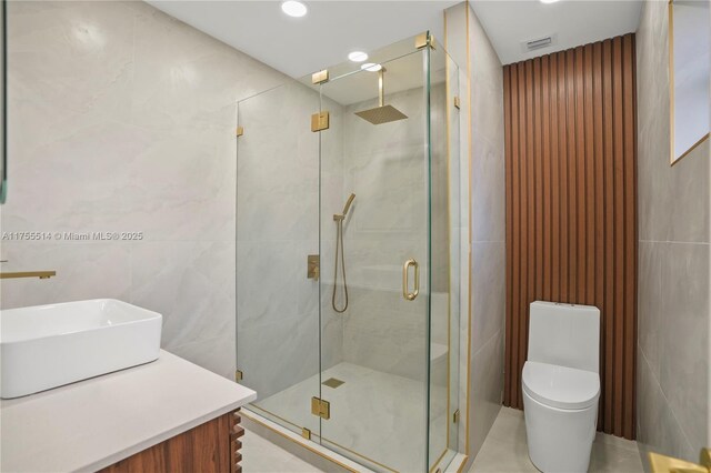 5280 SW 90th Ave, Cooper City, FL 33328 - bathroom with tile walls, a shower stall, toilet, vanity, and recessed lighting