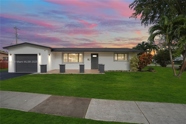 5280 SW 90th Ave, Cooper City, FL 33328 - ranch-style house featuring driveway, a garage, a front yard, and stucco siding