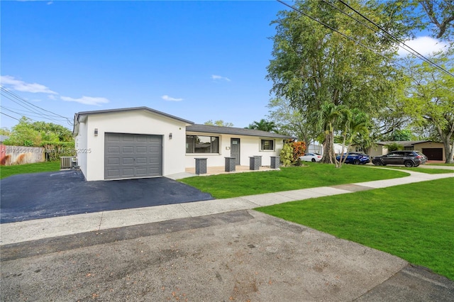 5280 SW 90th Ave, Cooper City, FL 33328 - view of front of house with stucco siding, driveway, a front yard, and central air condition unit