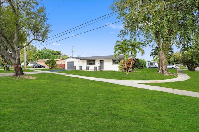 5280 SW 90th Ave, Cooper City, FL 33328 - ranch-style home with a front yard, driveway, stucco siding, and an attached garage