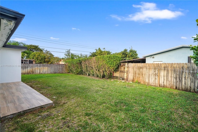 view of yard featuring a patio and a fenced backyard