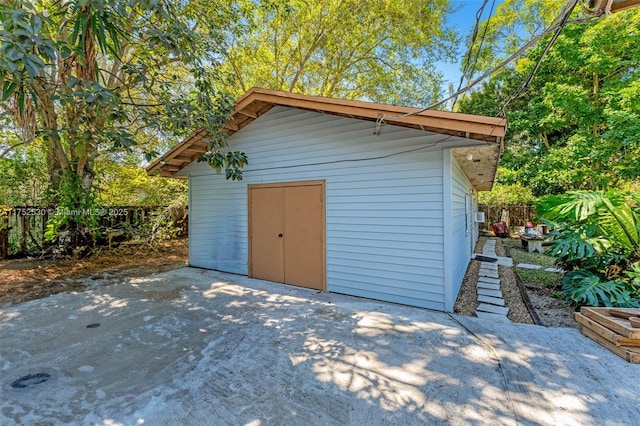 view of outdoor structure with an outdoor structure and fence