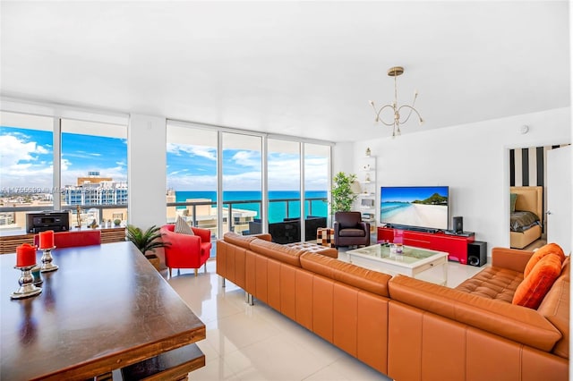 living area featuring expansive windows, light tile patterned floors, and a notable chandelier