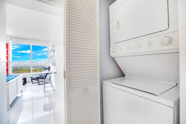 clothes washing area with laundry area and stacked washer / dryer