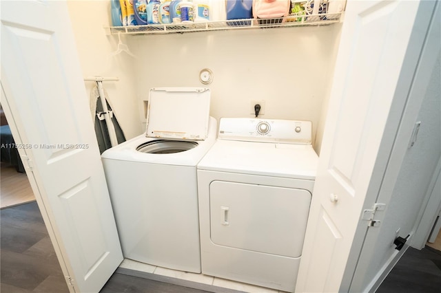 clothes washing area with laundry area, dark wood-style flooring, and independent washer and dryer