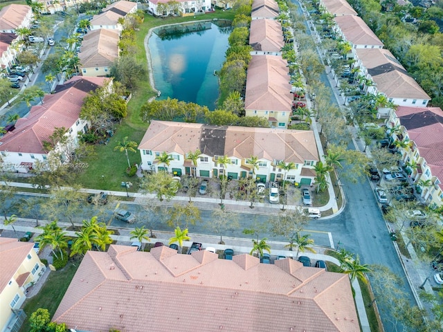 birds eye view of property featuring a residential view and a water view