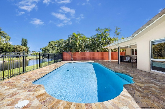 view of pool featuring a fenced backyard, a fenced in pool, a ceiling fan, and a patio