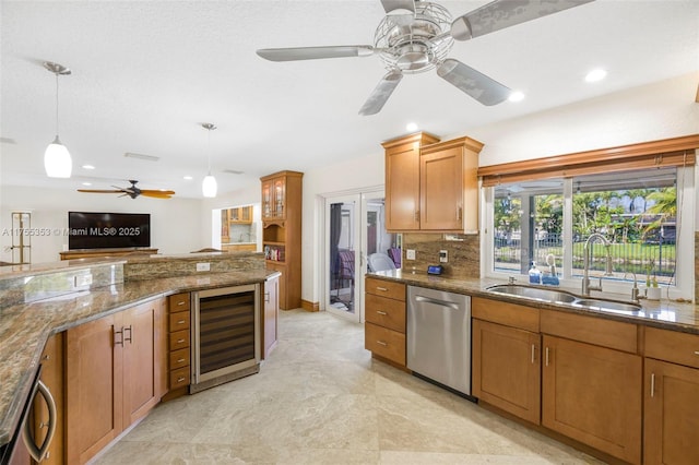 kitchen featuring beverage cooler, tasteful backsplash, dishwasher, hanging light fixtures, and a sink
