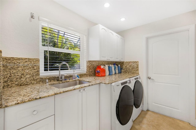 laundry area with washer and clothes dryer, light tile patterned floors, recessed lighting, cabinet space, and a sink